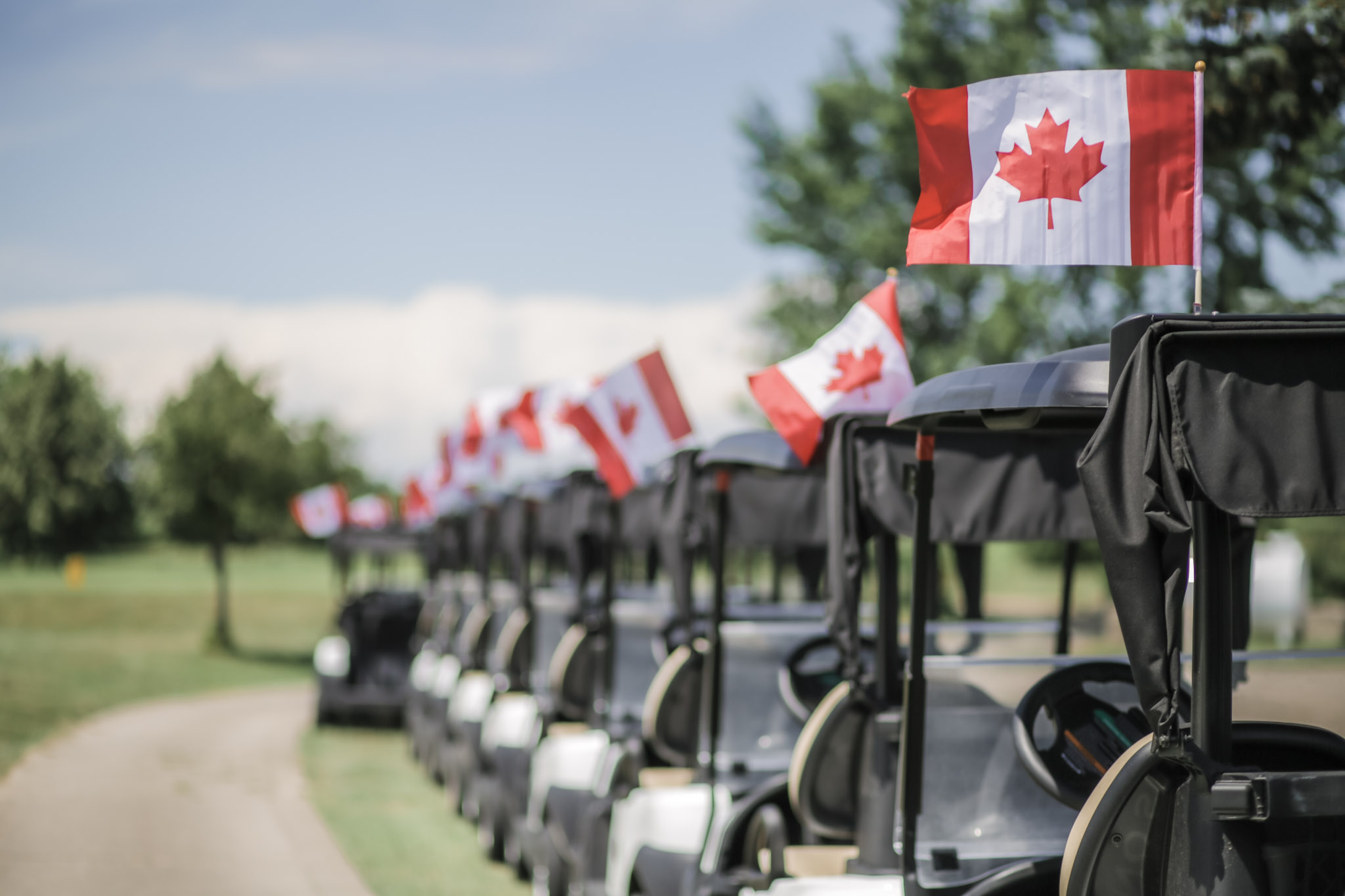 golf carts displaying the Canadian flag