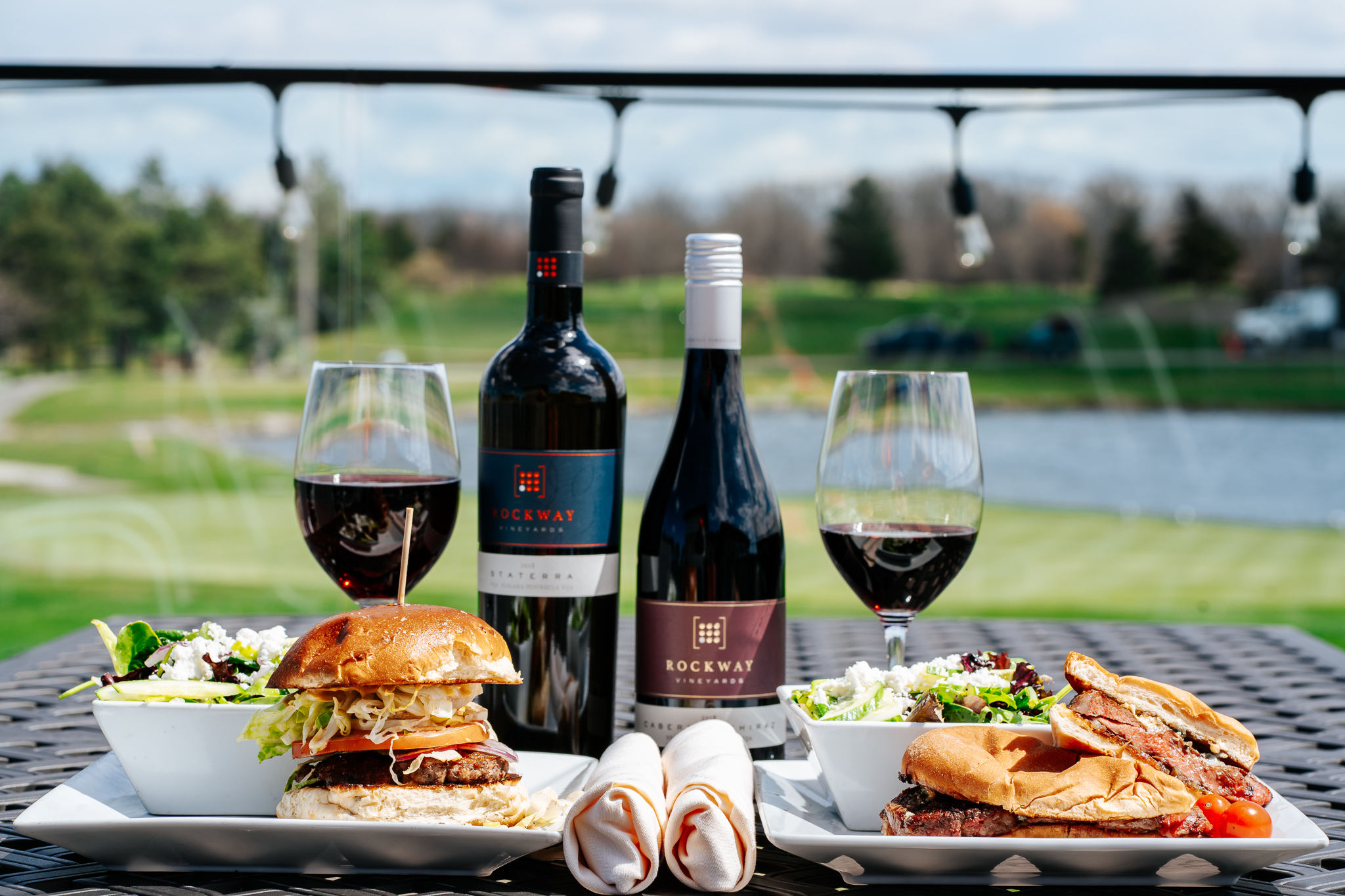 wine and sandwiches on a table on our patio